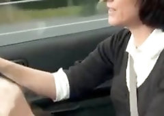 Brunette cougar masturbates in a car